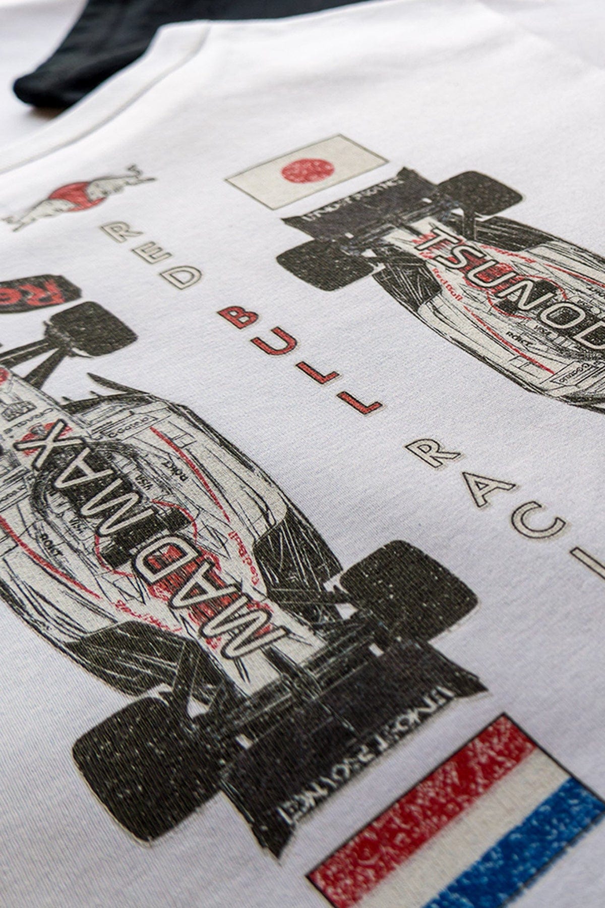 Close up of white custom Red Bull F1 crop shirt designed by Utmost Province.
