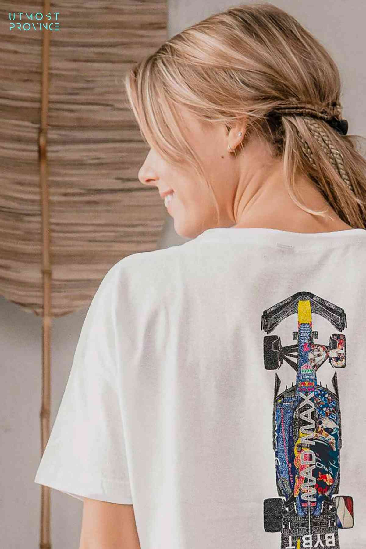 Model in a Utmost Province Red Bull F1 shirt, showcasing the graphic design on the back.