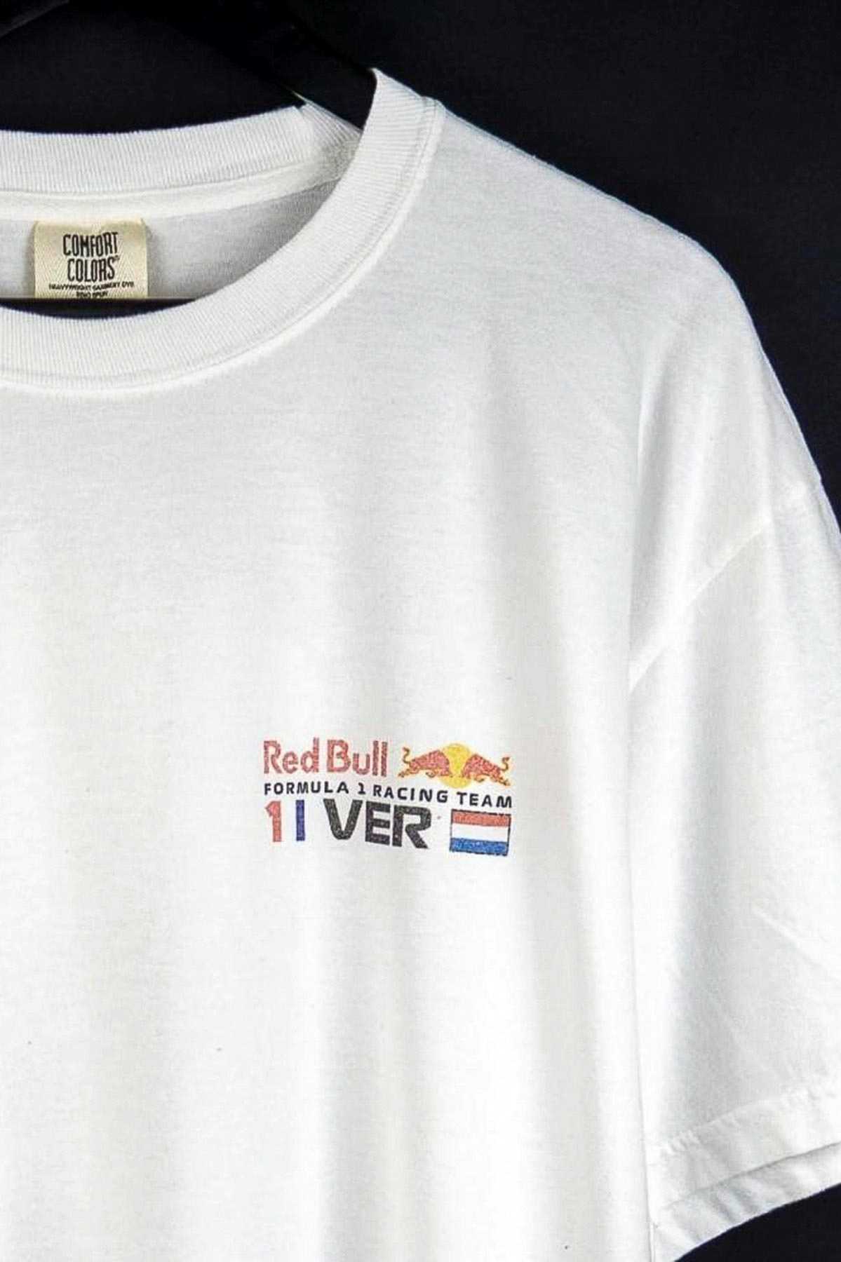 Utmost Province Red Bull F1 shirt, on a hanger showcasing the front left chest graphic design on the front of the F1 shirt.