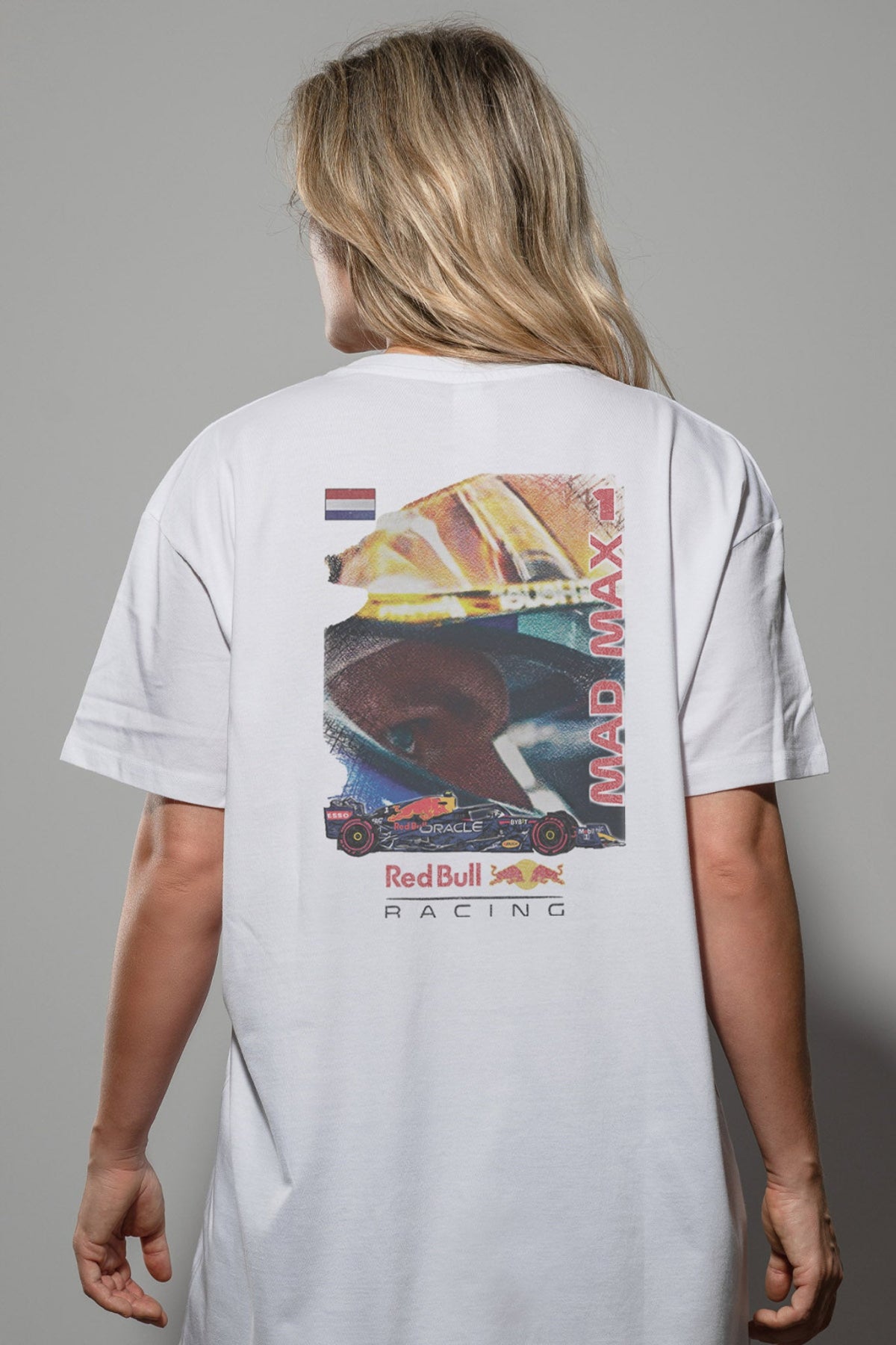 Women wearing a Red Bull F1 t shirt, featuring a graphic design that is printed on a White Comfort Colors shirt.