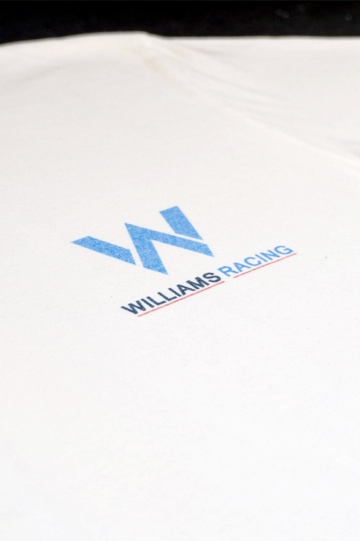 Front of a white Comfort Colors shirt, featuring Utmost Province custom Williams Racing inspired graphic design.