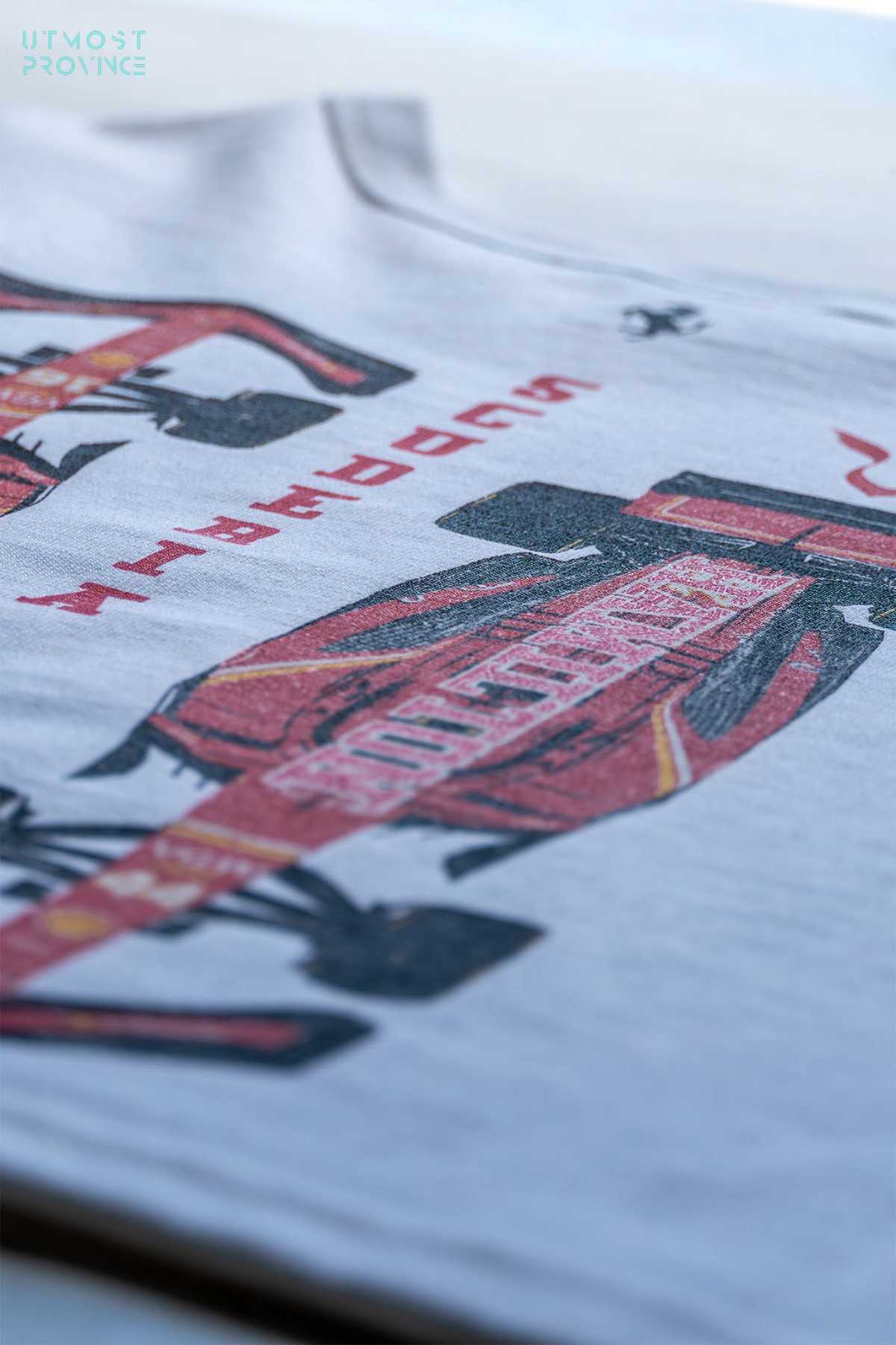 Utmost Province custom Ferrari crop top shirt laid flat on a table, highlighting the exclusive graphic design on the back.