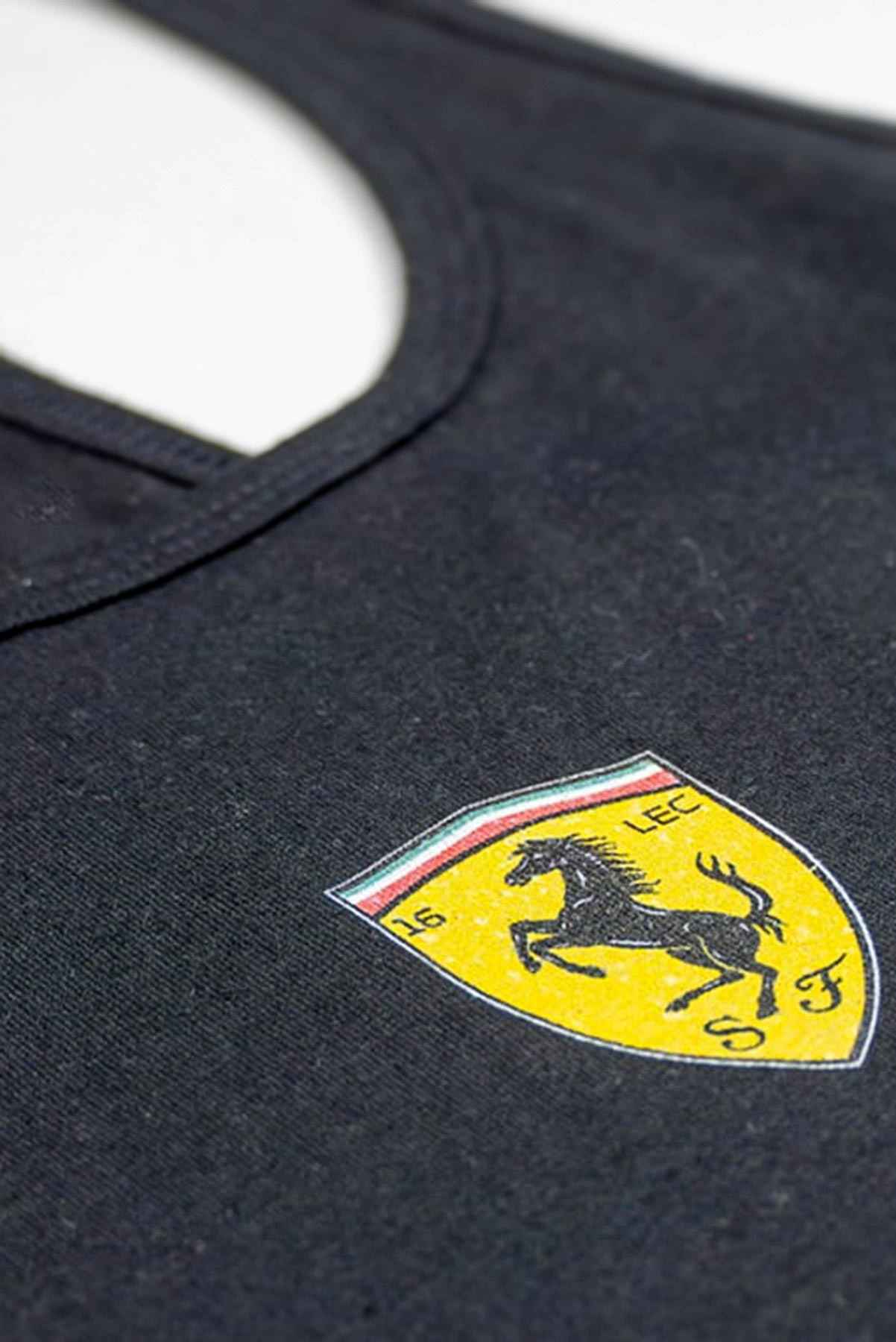 Women's tank tops laid flat on a table, highlighting the front center design of the custom Ferrari F1 merch.