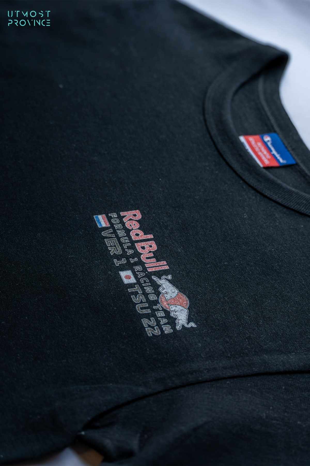 Red Bull Racing-inspired crop top shirt laid flat on a table, highlighting the design on the front of the custom F1 merch.